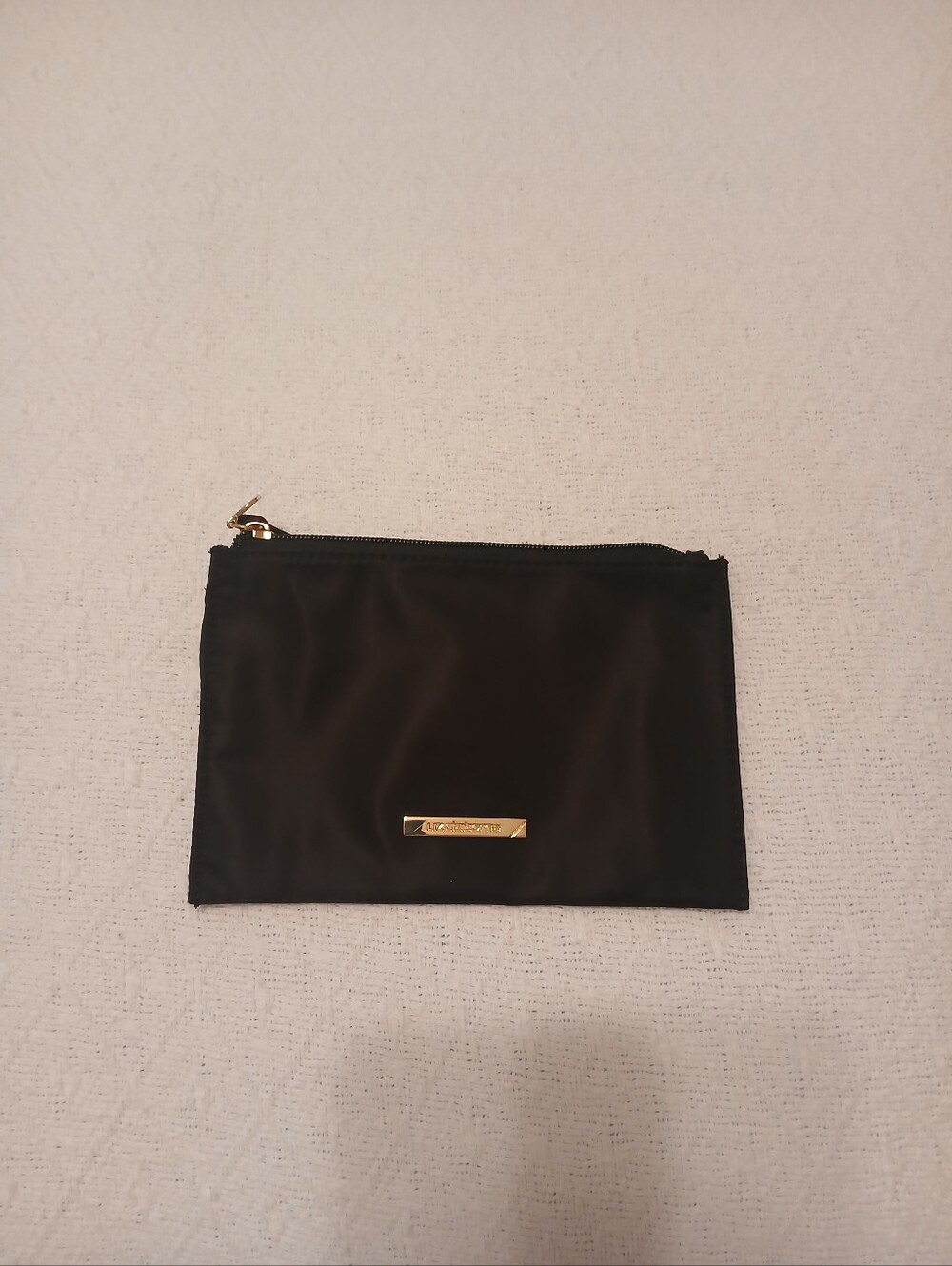 Liz Claiborne black makeup pouch with gold-color trim
